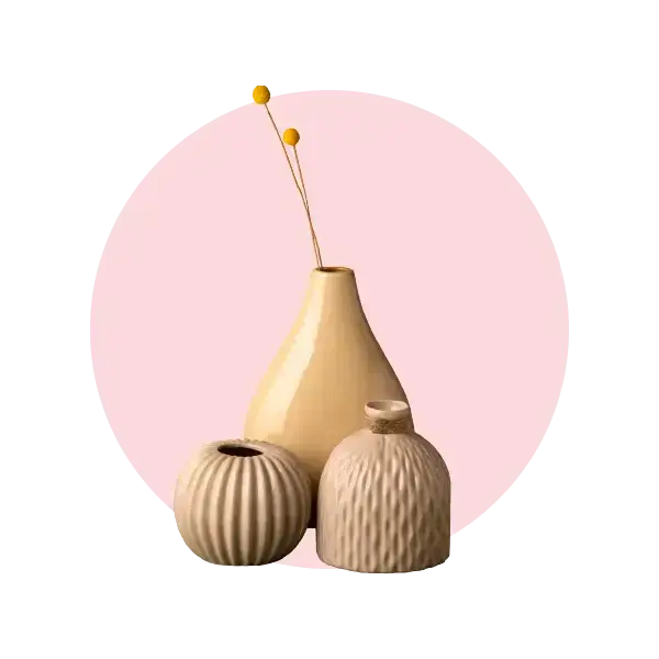 Elegant artisan vases in neutral tones with a floral accent, perfect for flower delivery in Melbourne.