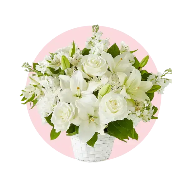 Elegant white funeral flowers arrangement in a basket, symbolizing sympathy and comfort during times of loss.