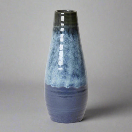 Arabella Vase Blue with a smooth glossy finish, featuring a serene gradient of blue shades.