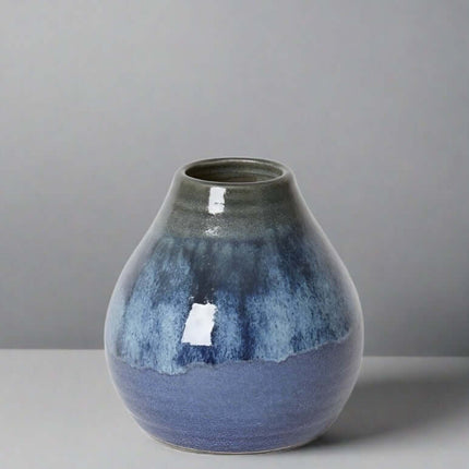 Arabella Vase Blue with soothing gradient of blue shades and glossy finish, perfect for elegant decor and floral displays.