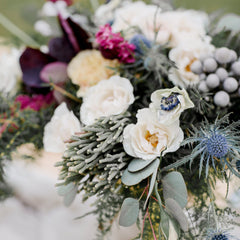 Custom wedding flower arrangement with white roses, lilies, and greenery, perfect for a Melbourne wedding.