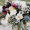 Custom wedding flower arrangement with white roses, lilies, and greenery, perfect for a Melbourne wedding.