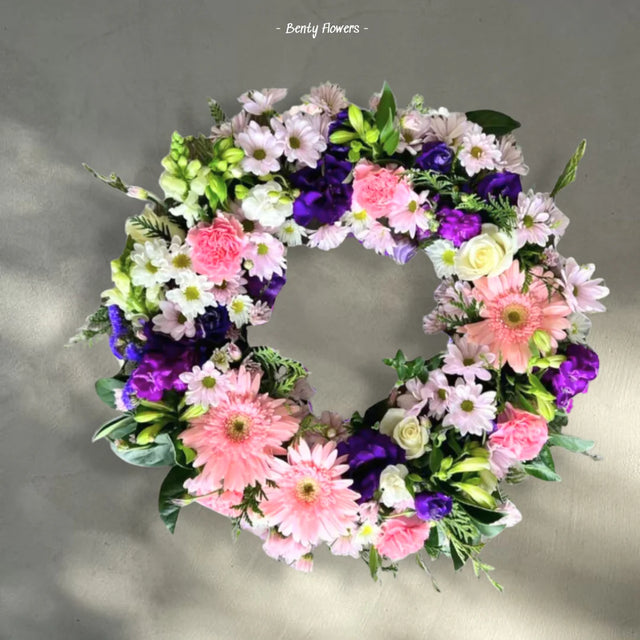 Elegant white lily and rose sympathy flower arrangement for funeral service in Melbourne.