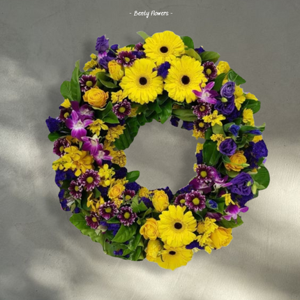 Sunshine Reverence – Vibrant Wreath with Gerberas, Roses, and Orchids