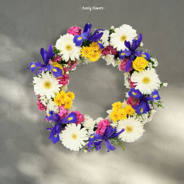 Bright Reflections – Colorful Wreath with Gerberas, Irises, and Roses