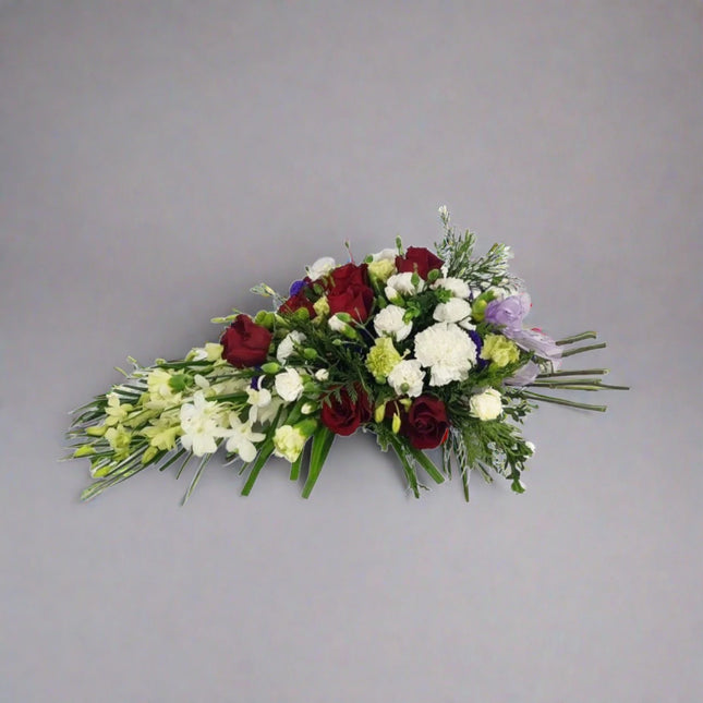 Sympathy Spray with White Roses, Red Carnations, and Mixed Foliage