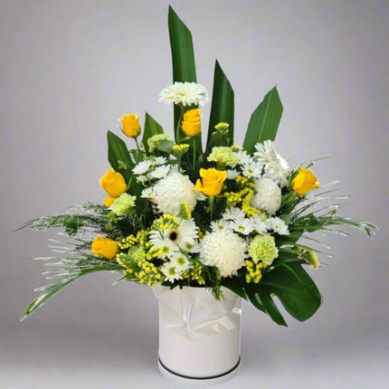 Sunny Delight vase arrangement with yellow roses, white chrysanthemums, white gerberas, yellow solidago, and lush greenery.