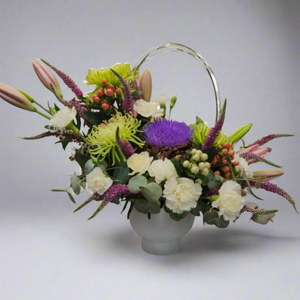 Tranquil Elegance – Pastel Floral Vase with lilies, purple asters, green chrysanthemums, white roses, and seasonal greenery.