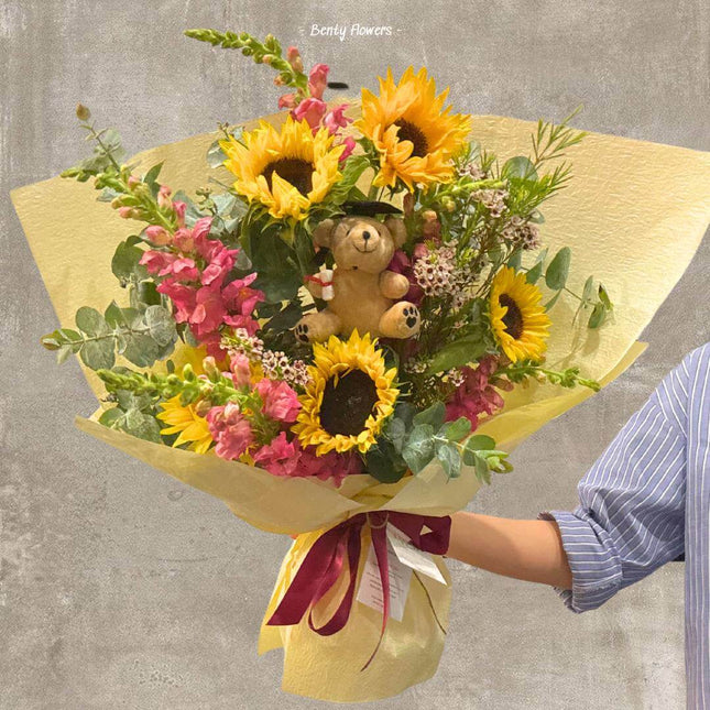 Teddy Shine graduation bouquet featuring sunflowers and a teddy bear, ideal for celebrating success in Melbourne.