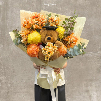 Graduation Orange Chrysanthemum Bouquet with Teddy Bear – A Bold Celebration