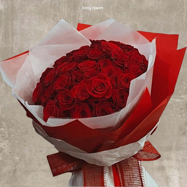 Valentine Glory bouquet featuring 60 premium red roses for romantic occasions, beautifully arranged with elegant wrapping.