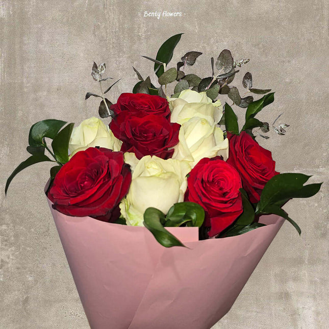 Romantic Harmony bouquet featuring deep red and creamy white roses, elegantly wrapped for a special occasion.