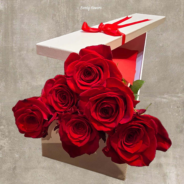 Luxurious romantic red roses in a white gift box with ribbon, perfect for expressing love in Melbourne.