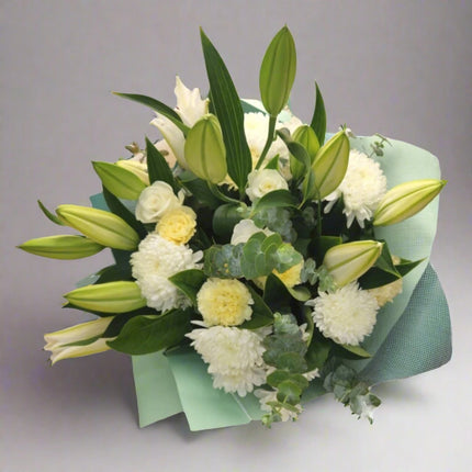 Tranquil White – Elegant Lily Bouquet with white lilies, chrysanthemums, and roses.