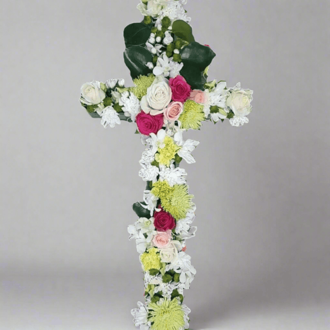 Faith Cross floral tribute arrangement, crafted with roses and lilies for funerals in Melbourne.