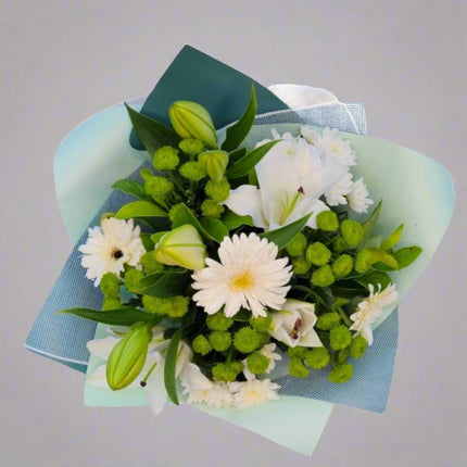 Fresh Harmony bouquet with white lilies, white gerberas, green button mums, and lush greenery