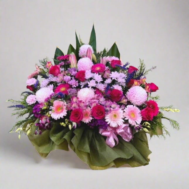 Pink Perfection – Lush Floral Display with pink gerberas, lavender chrysanthemums, and roses.