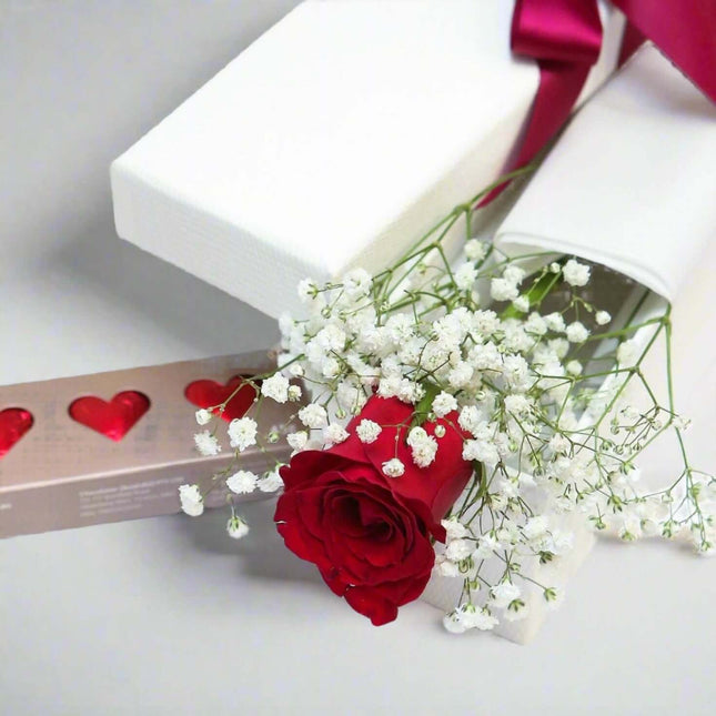 Elegant red rose with gypsophila and a gift box, symbolizing love and romance in Melbourne.