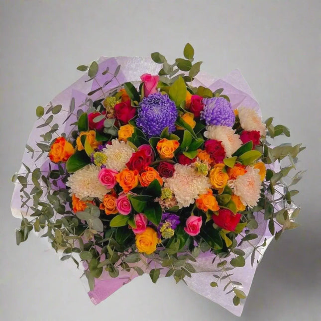 Vibrant Colour Pop bouquet featuring roses, seasonal blooms, and greenery, perfect for birthdays and joyful celebrations in Melbourne.