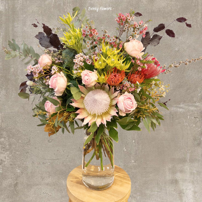 Native Elegance Bouquet featuring King Protea, Roses, and Seasonal Blooms in a beautiful arrangement with same-day delivery.