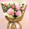 Beautiful bouquet of pink roses and chrysanthemums wrapped for birthday and anniversary celebrations.
