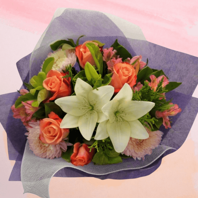Radiant bouquet with roses, lilies, and greenery, perfect for birthday and anniversary celebrations in Melbourne.