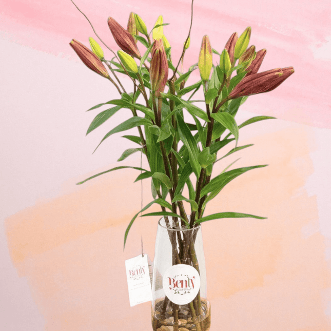 Elegant lily bouquet in glass vase, fresh floral arrangement delivered in Melbourne.