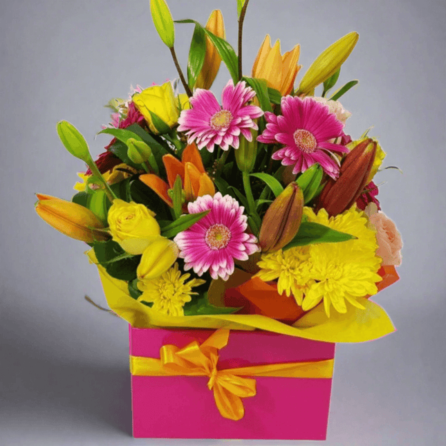 Bloom Pop boxed flower bouquet with vibrant pink, yellow, and orange blooms, perfect for gifts or celebrations in Melbourne.